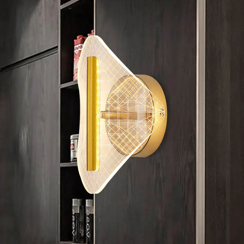 Modern geometric gold sconce light with translucent diffuser and illuminated vertical strip for living room use