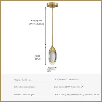 A sleek modern pendant light with gold-toned copper frame and clear crystal glass shade for decorbites crystal led pendant lighting