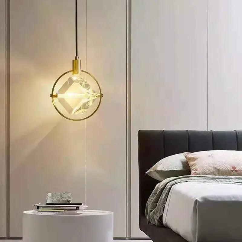 Modern geometric gold pendant lights with circular frame and faceted crystal led centerpiece for dining room decorbites crystal led