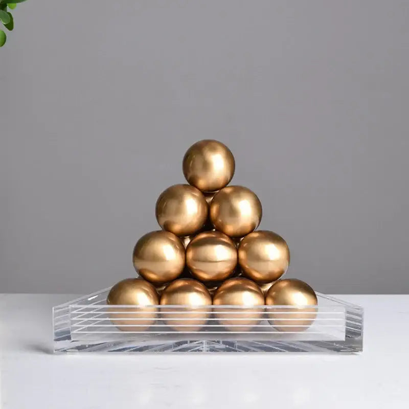 Modern geometric gold tower set with glossy gold metallic spheres on clear acrylic base for decorbites geometric gold decor