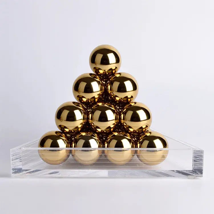 Modern geometric gold tower set featuring polished gold metallic spheres on a clear acrylic base for decorbites geometric gold decor