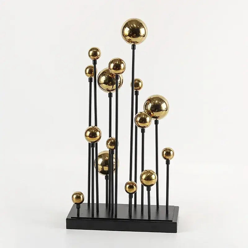 Modern geometric golden ball sculpture featuring polished gold spheres on black rods for living room metal decor