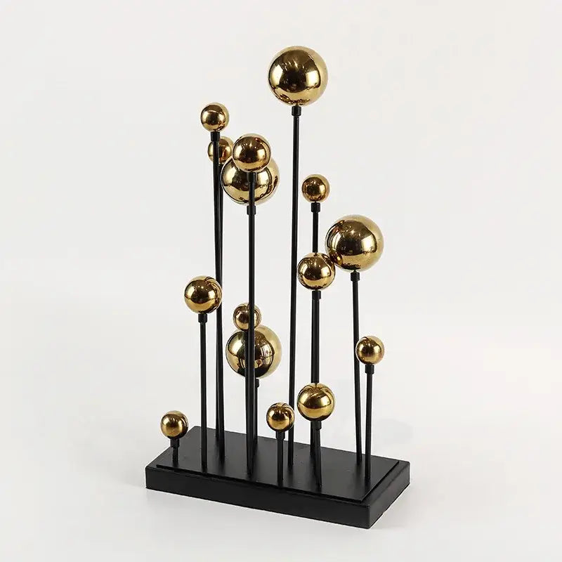 Modern abstract geometric golden ball sculpture with polished gold spheres on black rods for living room decor