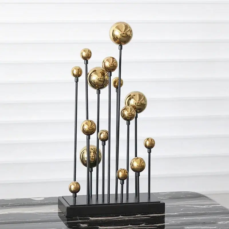 Modern abstract geometric golden ball sculpture with multiple golden spheres on black metal rods for living room decor