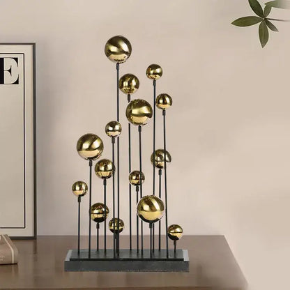 Modern geometric golden ball sculpture featuring polished gold spheres on black rods for living room metal decorbites decor
