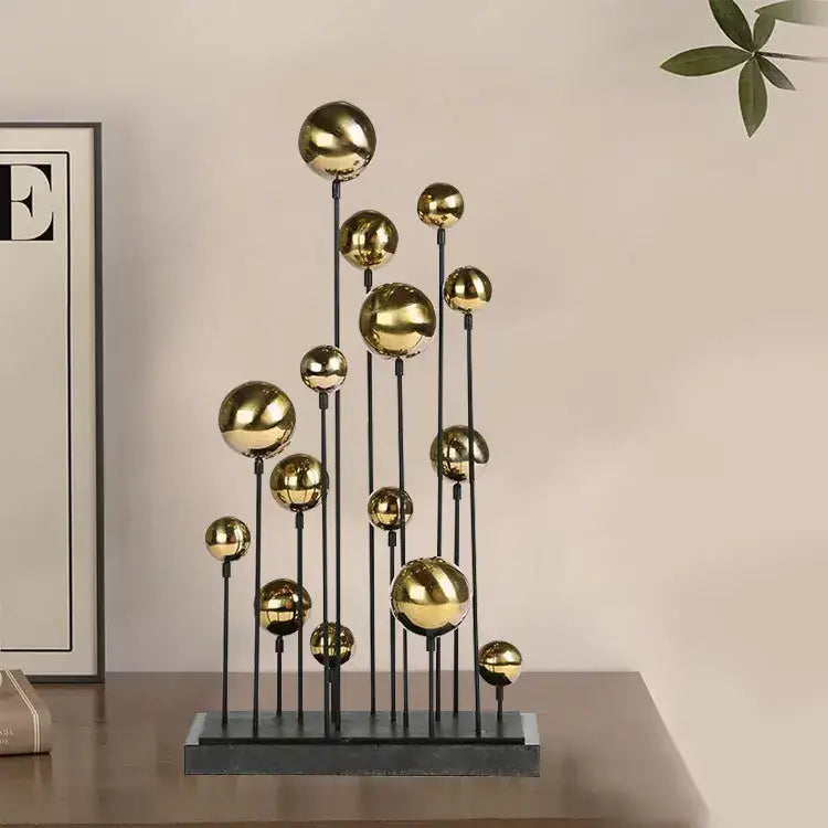 Modern geometric golden ball sculpture featuring polished gold spheres on black rods for living room metal decorbites decor