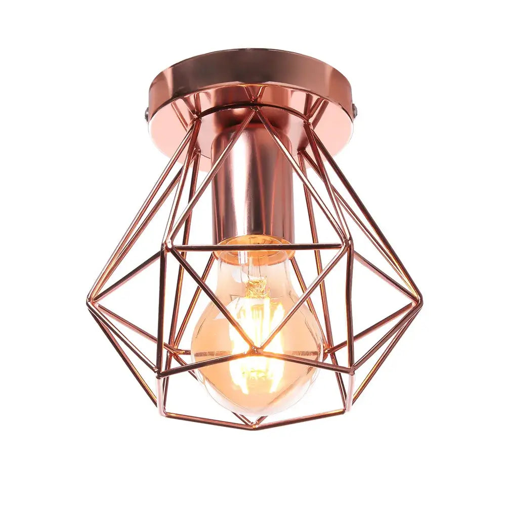 Rose gold ceiling light with geometric iron frame cage and exposed filament bulb for aisle and loft decorbites iron frame