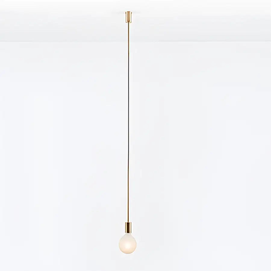 Minimalist pendant light with slender brass rod and frosted glass bulb in decorbites geometric iron pendant for dining room