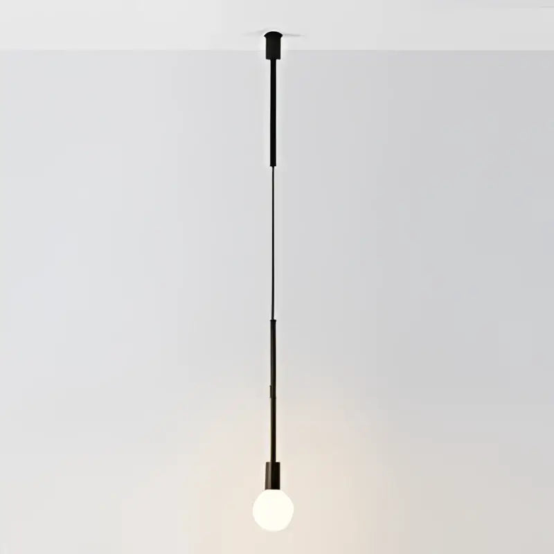 Minimalist black pendant light with sleek slender rod and exposed bulb from decorbites geometric iron pendant collection