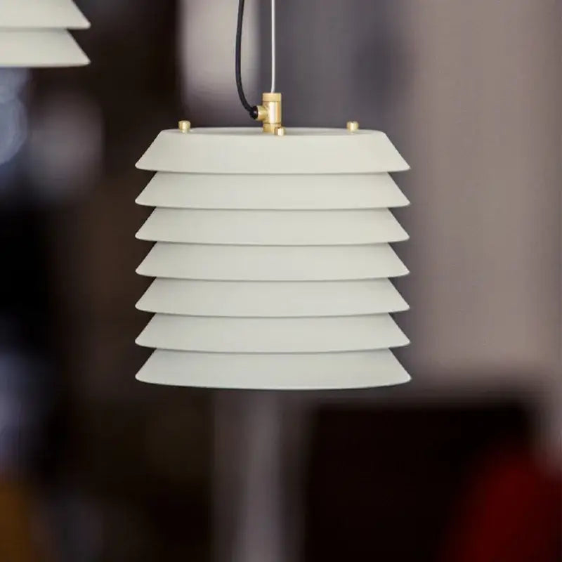 Modern geometric iron table lamp with off-white layered pendant and brass accents for white and gray decorbites geometric iron living room
