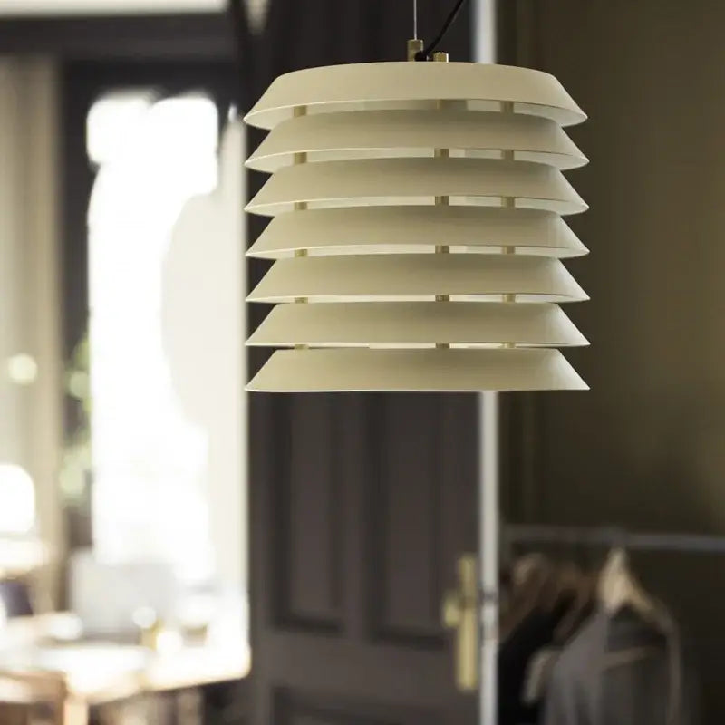 Modern geometric iron table lamp featuring a cream tiered pendant with sleek iron table lamp design for living room decorbites
