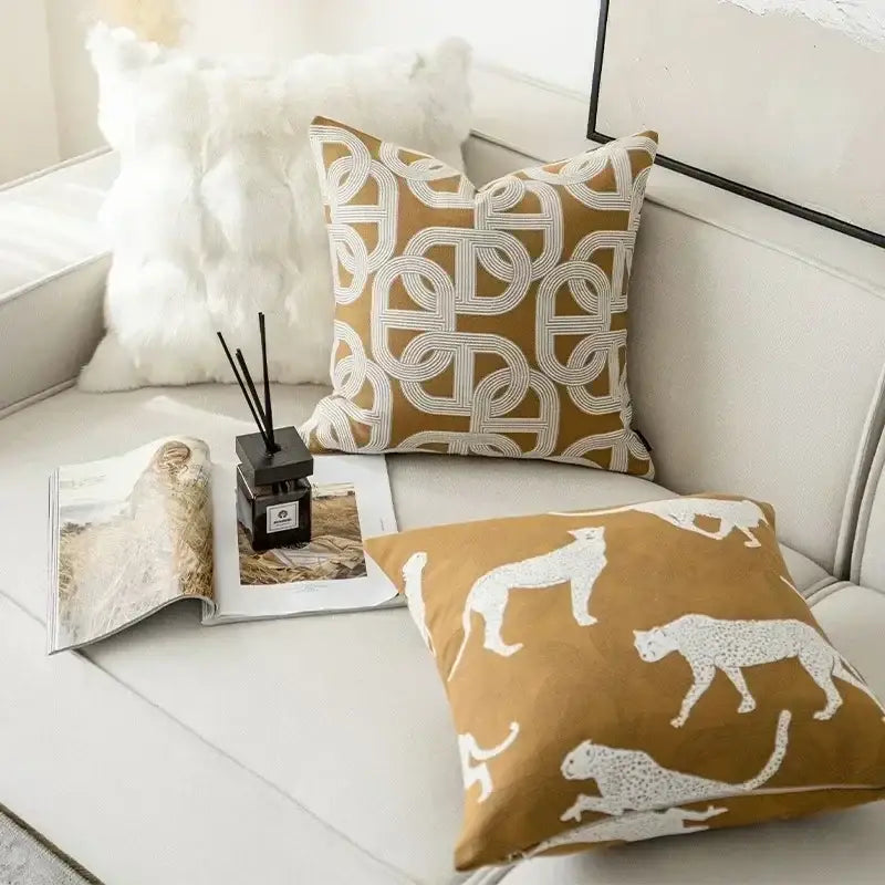 Tan cushion cover with white leopard silhouettes and geometric jacquard pattern for living room decorbites geometric jacquard