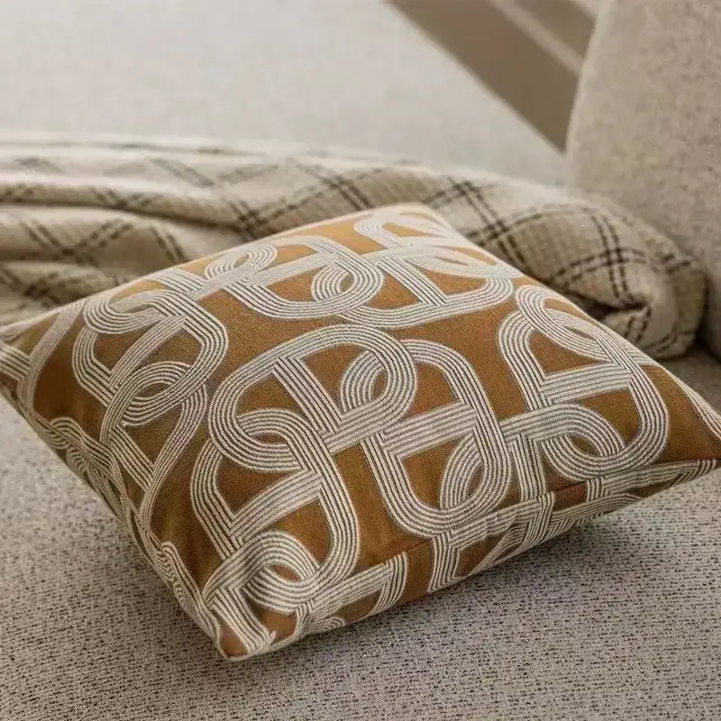 Square mustard-yellow cushion cover with white geometric jacquard embroidery for modern decorbites living room use
