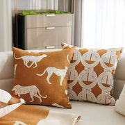 Brown cushion cover with white embroidered cheetah silhouettes and decorbites geometric jacquard pattern for living room decor