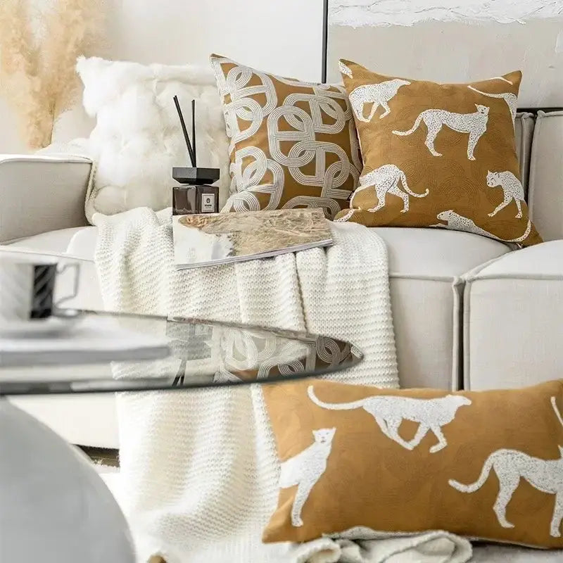 Tan cushion cover with white leopard silhouettes in textured fabric decorbites geometric jacquard cushion for living room