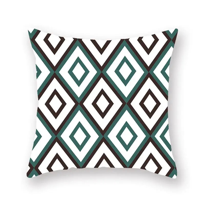 Square throw pillow with bold teal white and black geometric leaf flower pattern for modern decorbites living room decor