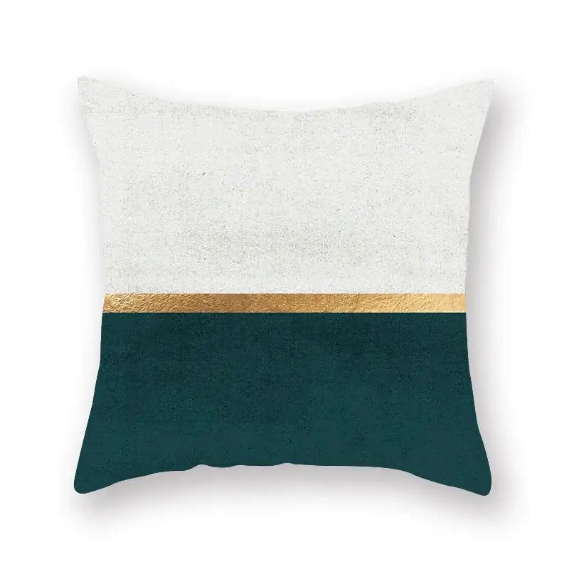 Modern throw pillow with textured white top, metallic gold stripe, and deep teal bottom for decorbites geometric leaf decor