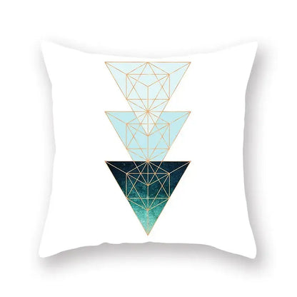 White throw pillow with modern geometric leaf flower design of stacked blue triangles outlined in gold for living room decorbites