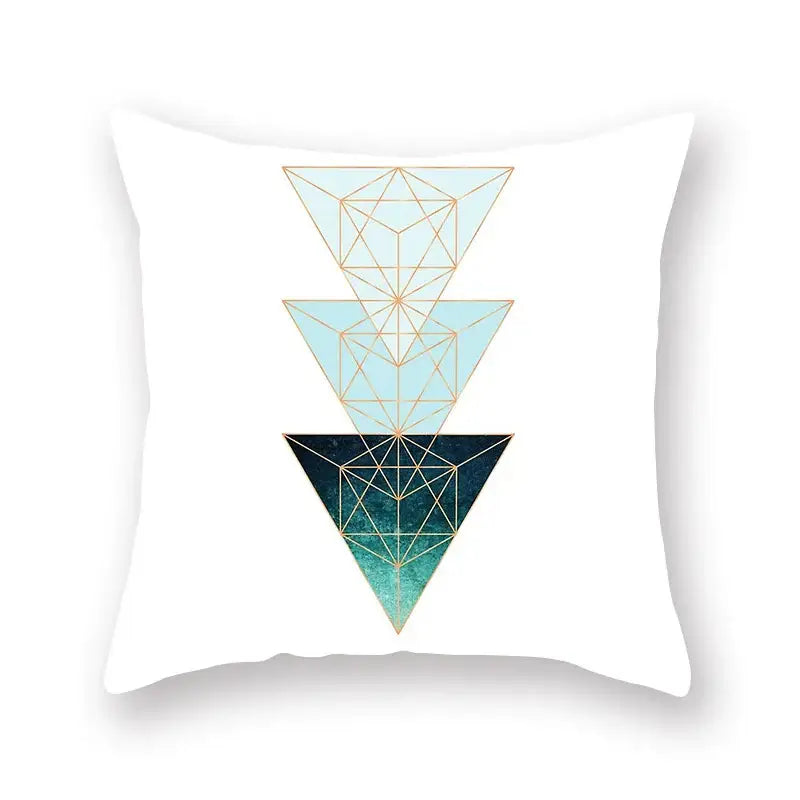 White throw pillow with modern geometric leaf flower design of stacked blue triangles outlined in gold for living room decorbites