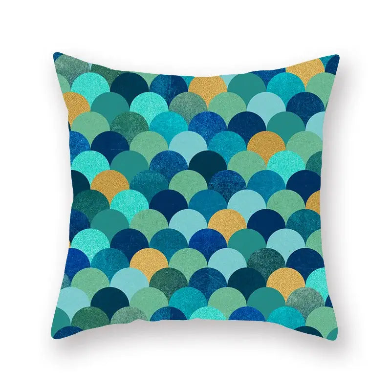 A square throw pillow with vibrant teal blue and gold overlapping scale pattern for decorbites geometric leaf decor