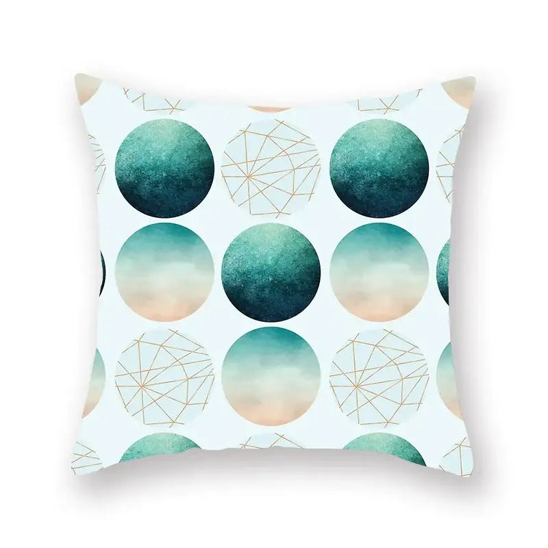 A square throw pillow with a modern decorbites geometric leaf pattern in teal peach and gold on white background