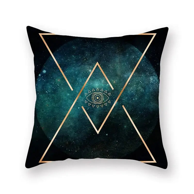 Black throw pillow with gold geometric triangles and ornate eye on teal starry background for decorbites geometric leaf decor