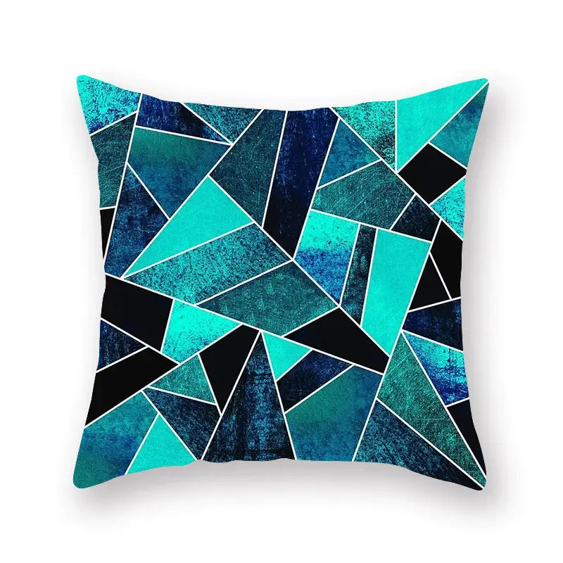 A square throw pillow with a bold geometric leaf flower pillowcase in teal navy blue and black decorbites geometric leaf design