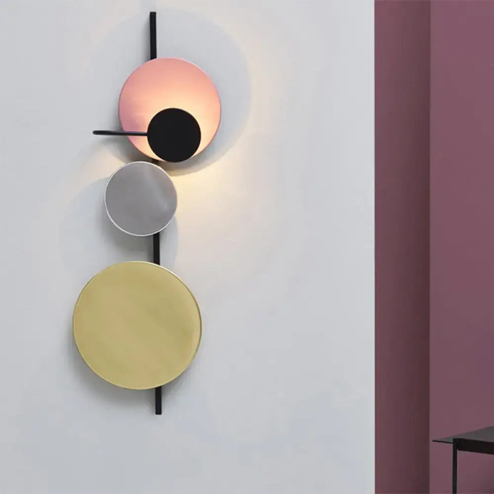 Modern geometric led wall light with stacked red pink blue discs in black metal frame for living room sconce decor