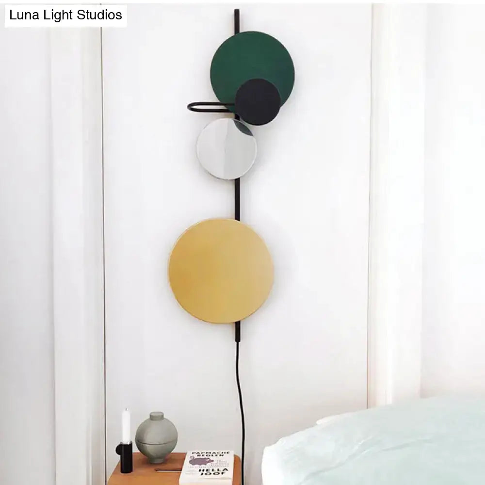 Modern led wall light with stacked discs in matte green black gold and sleek frame for red pink blue living room sconce