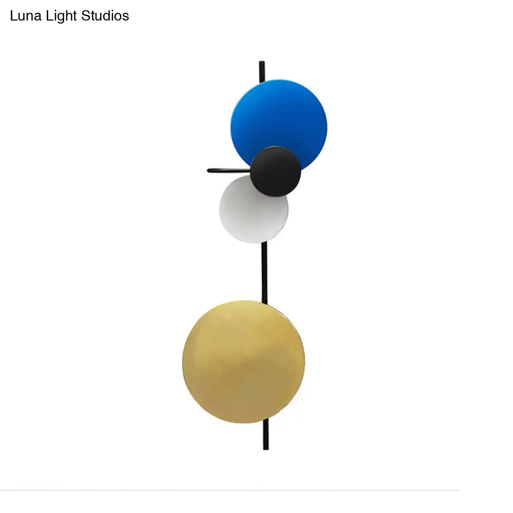 Modern geometric led wall light living room sconce with four blue, black, white, and gold spherical shades on black rod