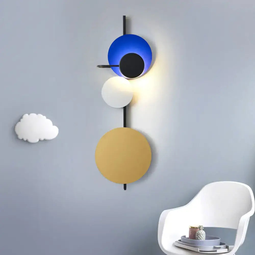 Modern geometric led wall light with stacked circular shades in blue black white and gold for red pink blue decor