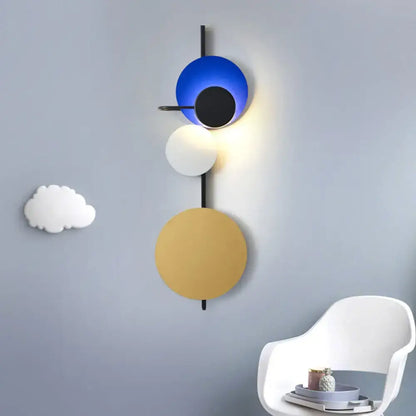 Modern geometric led wall light with stacked circular shades in blue black white and gold for red pink blue decor