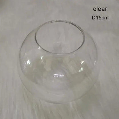 Clear glass fishbowl with rounded design and 15cm diameter featured in modern geometric magic bean lighting smoke and amber globe