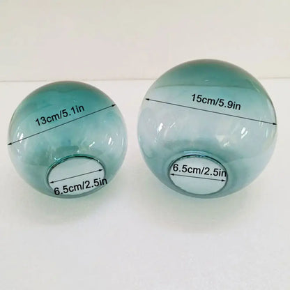 Two translucent teal glass spheres 13cm and 15cm diameter in modern geometric magic bean lighting design