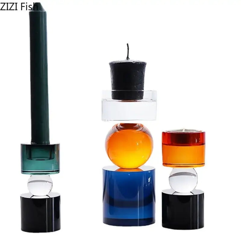 Set of three modern crystal candle holders with stacked geometric designs in teal orange and red for dining room use