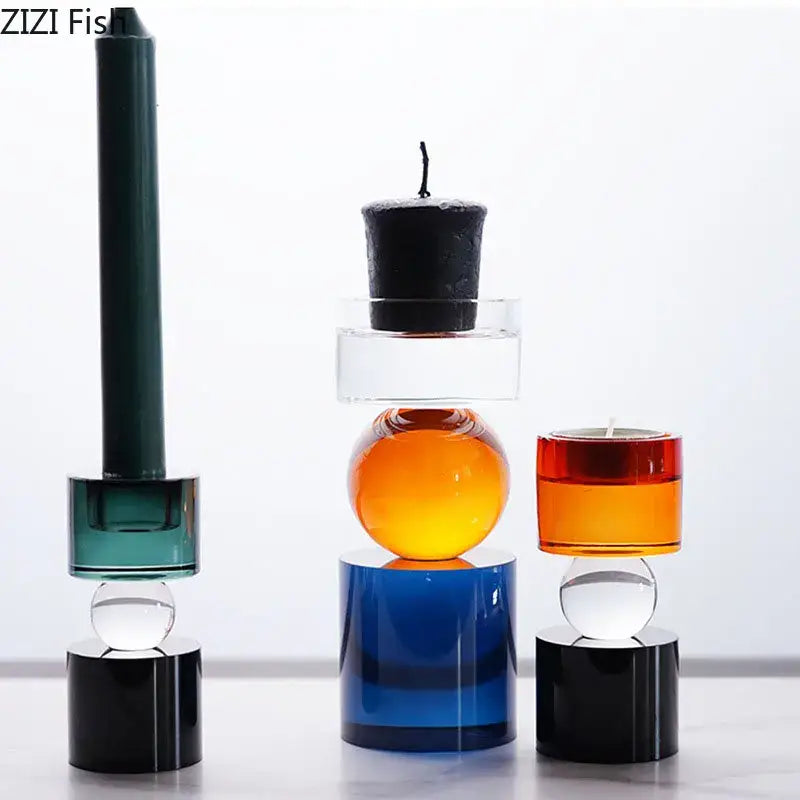 Modern geometric orange and black crystal candle holders with vibrant teal, orange, and blue glass shapes for dining room