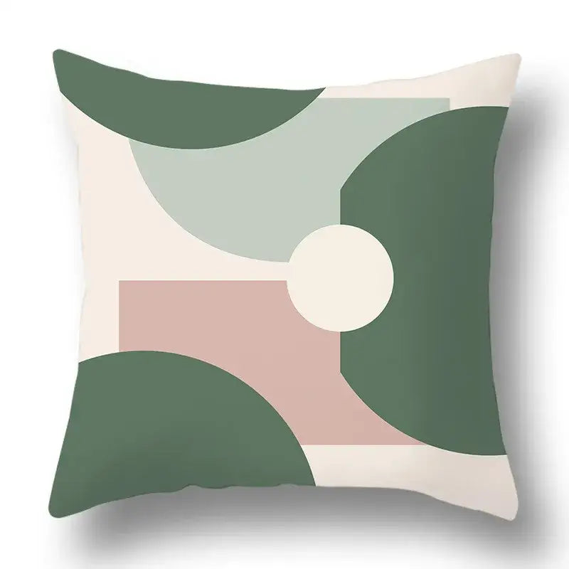 A square pillow cover with modern geometric print in green, beige, and soft pink from decorbites green plants