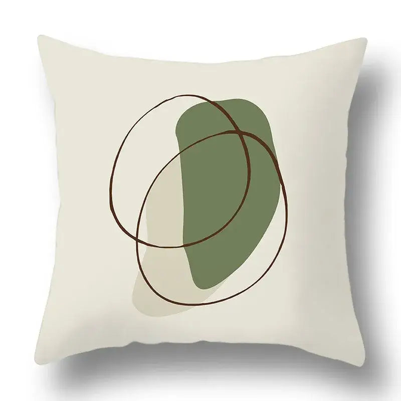 Cream-colored pillow cover with geometric print featuring sage green shape and thin brown lines decorbites green plants decor
