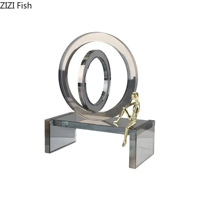 A sleek gold metallic figure on a transparent acrylic ring chair base with silver geometric rings for living room decor
