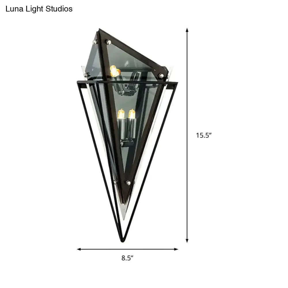 Modern geometric smoke gray led wall lamp with black metal and glass frame and three exposed filament bulbs