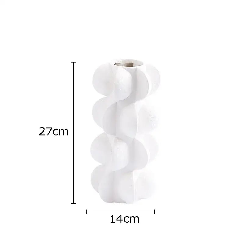 A sleek white ceramic vase with geometric spiral resin design and rounded protrusions for modern living room decor