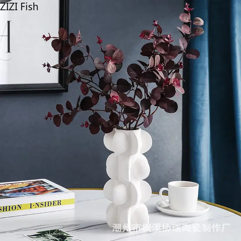 White ceramic vase with modern stacked bubble design featured as decorbites geometric spiral resin living room decor