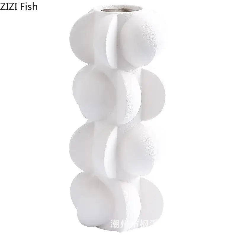 White ceramic vase with modern segmented stacked circular design in decorbites geometric spiral resin style for living room decor