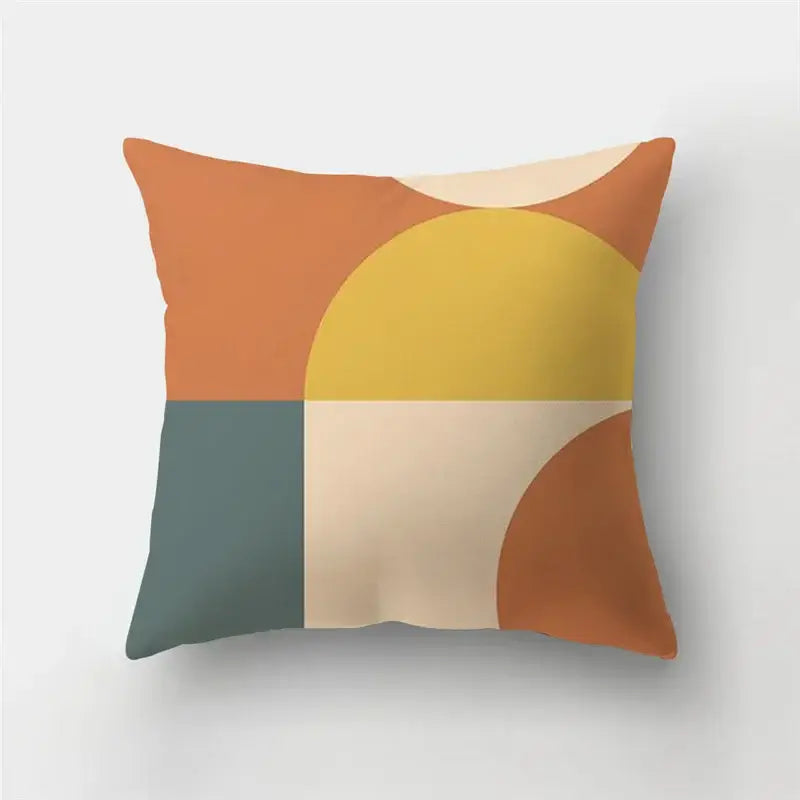 A square throw pillow case with modern geometric stripe patchwork design in warm orange yellow beige and muted teal colors