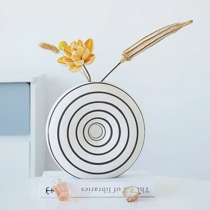 White ceramic vase with black geometric stripes and concentric circles for modern living room decorbites geometric stripes