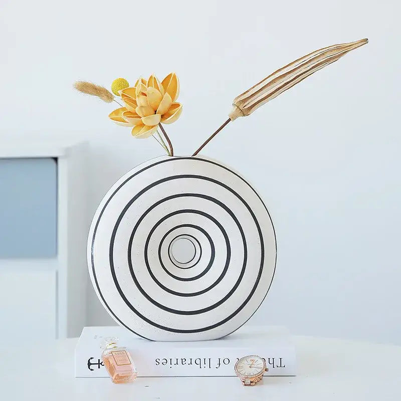White ceramic vase with black geometric stripes and concentric circles for modern living room decorbites geometric stripes