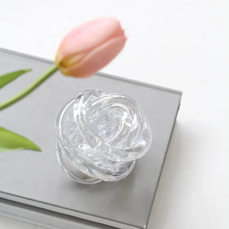 Modern geometric transparent clear glass coil wound ball shaped like a rose for living room decor
