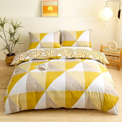 Modern geometric triangle block print bedding set featuring yellow white and gray geometric-patterned duvet cover