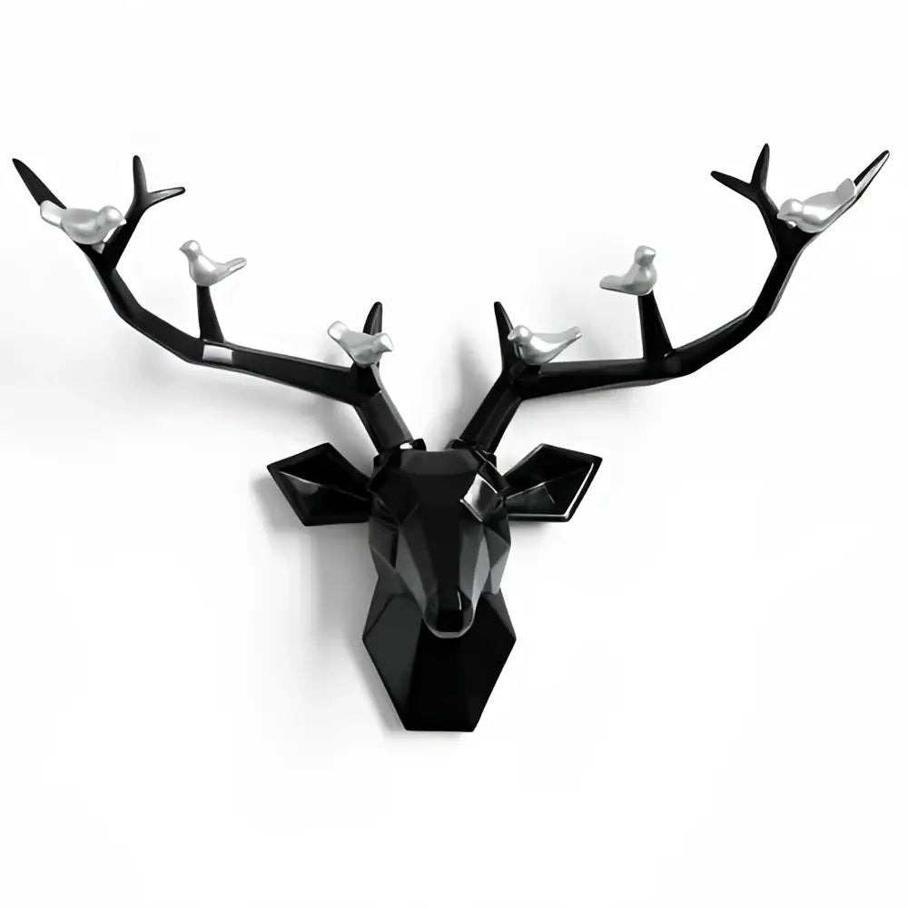 Modern black geometric deer head wall decor with silver birds perched on antlers for stylish living room display