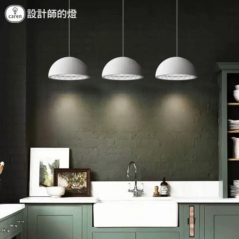 Three sleek white dome pendant lights made of decorbites creamy gypsum for modern bedroom decor